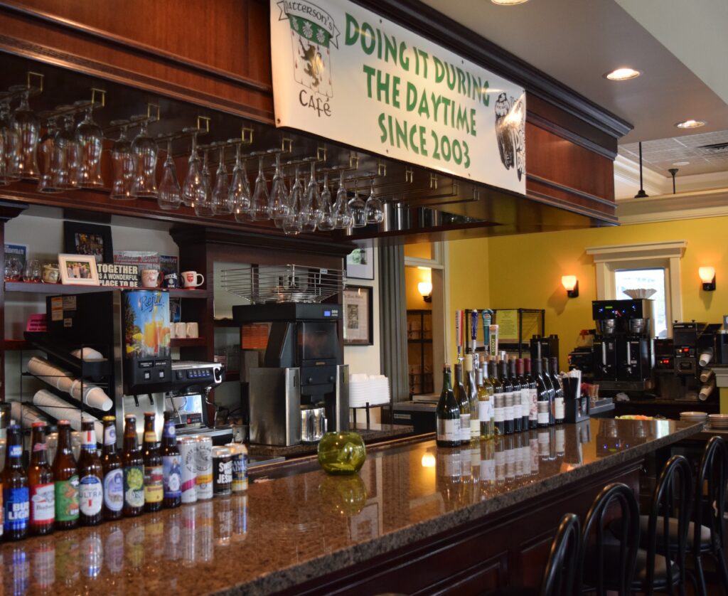bar which has the wine and beer bottles all lined up on it